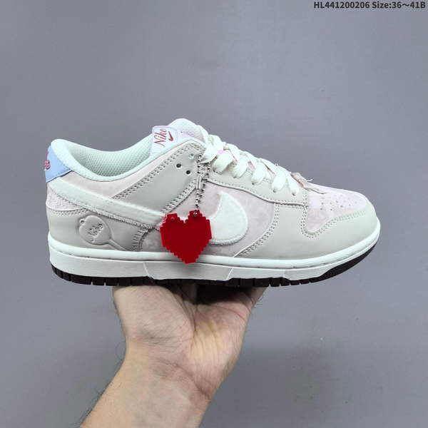 NIKE DUNK LOW VALENTINE'S DAY LIMITED EDITION FEATURES A GRADIENT COLOR SCHEME COMBINING MILK-WHITE AND SOFT MIST POWDER, CREATING AN EFFECT REMINISCENT OF A DELICATE SPRING VEIL DRAPED OVER SHOE.