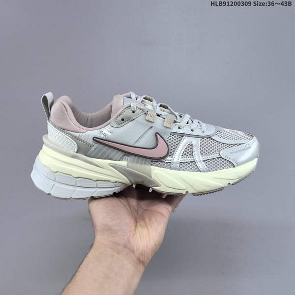 NIKE V2K RUN RUNNING SHOE EMBODIES A RETRO AESTHETIC, FEATURING A BREATHABLE MESH UPPER AND A SLEEK GRAY-SILVER MATERIAL THAT PROVIDES EXCELLENT SUPPORT. SWOOSH LOGO IS PROMINENTLY DISPLAYED ON BOTH SIDES OF SHOE AND ON ITS TOE AREA.