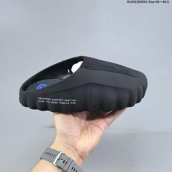 FRAGMENT DESIGN X NIKE MIND 001 – A COLLABORATION BETWEEN HIROSHI FUJIHARA AND NIKE, AVAILABLE IN BLACK AND BLUE FOR BOTH MEN AND WOMEN. THESE FOOT-SOOTHING SLIPPERS ARE SPECIFICALLY DESIGNED FOR INDOOR USE.