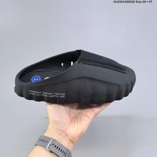 FRAGMENT DESIGN X NIKE MIND 001 – A COLLABORATION BETWEEN HIROSHI FUJIHARA AND NIKE, AVAILABLE IN BLACK AND BLUE FOR BOTH MEN AND WOMEN. THESE FOOT-SOOTHING SLIPPERS ARE SPECIFICALLY DESIGNED FOR INDOOR USE.