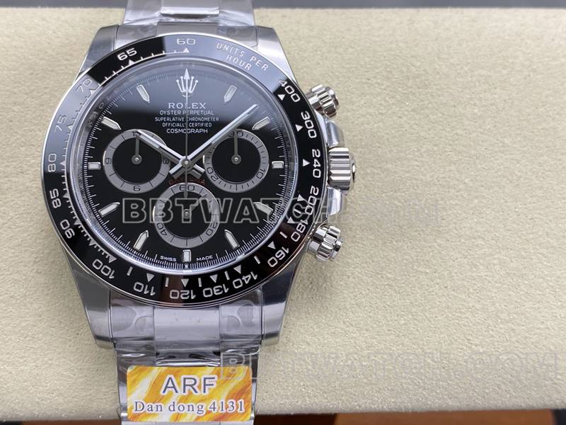 Real-life photos of the front of the ARF Factory Rolex Daytona with a black dial, spade-shaped hands, model 4131, and steel bracelet
