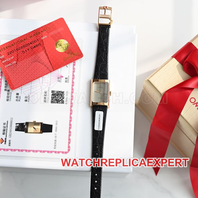 Real-life photo of the front of a top-tier Omega De Ville watch with a gray dial, quartz movement, and black leather strap