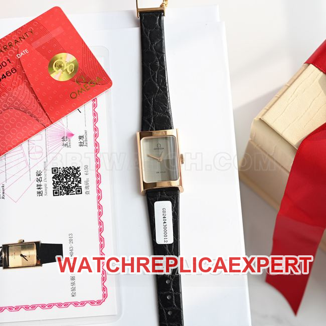 Real-life photo of the front of a top-tier Omega De Ville watch with a gray dial, quartz movement, and black leather strap