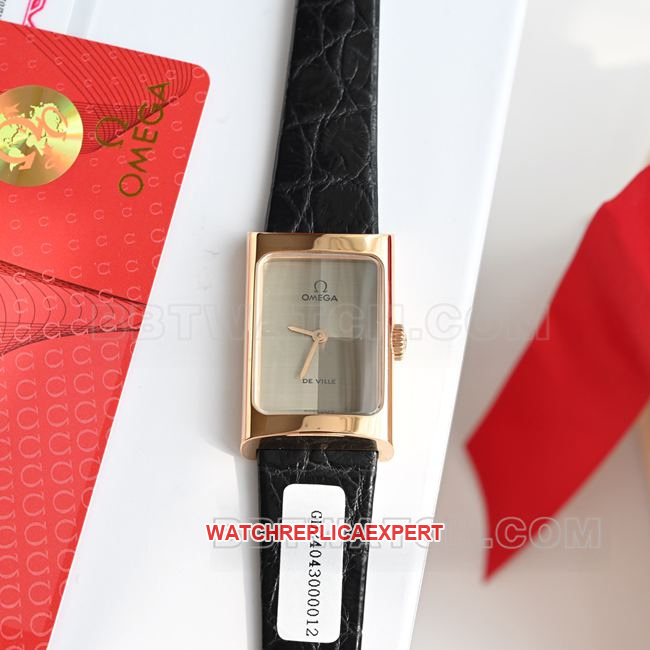 Real-life photo of the front of a top-tier Omega De Ville watch with a gray dial, quartz movement, and black leather strap
