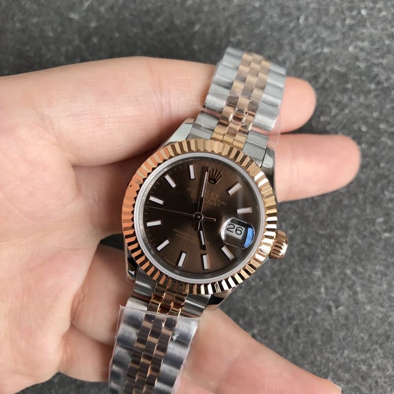 Rolex Datejust watch for women, 28mm, mechanical, with a tiger tooth bezel, rose gold case, and coffee-colored dial, front view.
