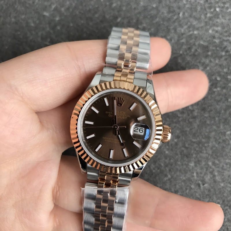 Rolex Datejust watch for women, 28mm, mechanical, with a tiger tooth bezel, rose gold case, and coffee-colored dial, front view.