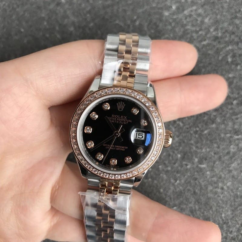 Rolex Datejust women's watch, 28mm, mechanical bezel with diamonds, rose gold case, black dial, front view