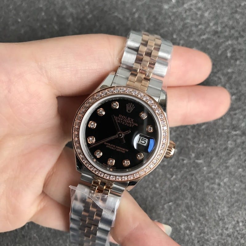 Rolex Datejust women's watch, 28mm, mechanical bezel with diamonds, rose gold case, black dial, front view