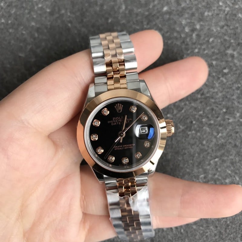 Rolex Datejust 28mm mechanical watch, fluted bezel, rose gold, black dial, diamond hour markers, front view