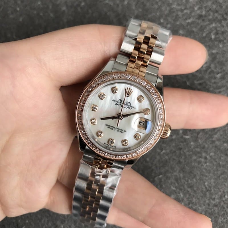 Rolex Datejust watch, women's 28mm, mechanical bezel, diamond, rose gold, mother-of-pearl dial, diamond hour markers, front view