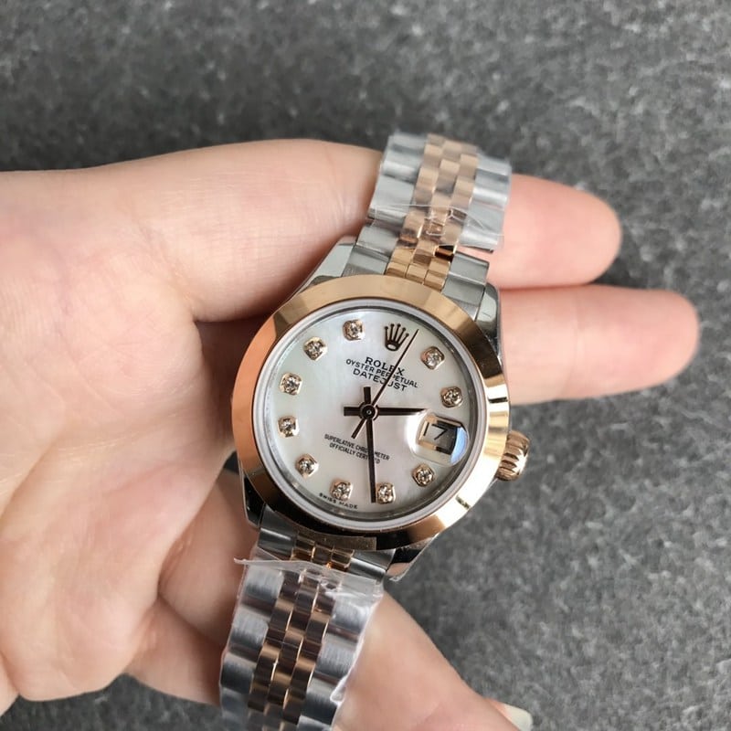 Rolex Datejust women's watch, 28mm, mechanical, fluted bezel, rose gold, mother-of-pearl dial, diamond hour markers, front view