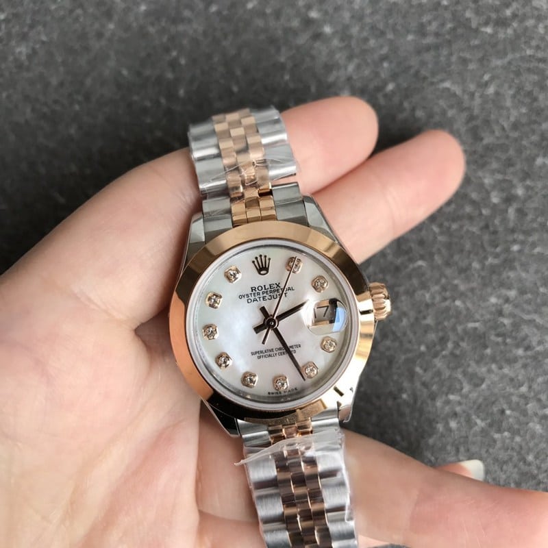 Rolex Datejust women's watch, 28mm, mechanical, fluted bezel, rose gold, mother-of-pearl dial, diamond hour markers, front view