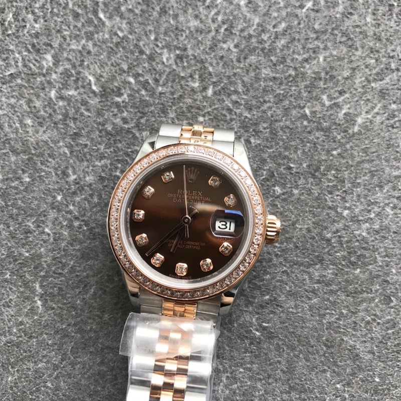 Refined Rolex Datejust women's watch, 28mm, mechanical bezel with diamonds, rose gold, coffee-colored dial, diamond hour markers, front view.