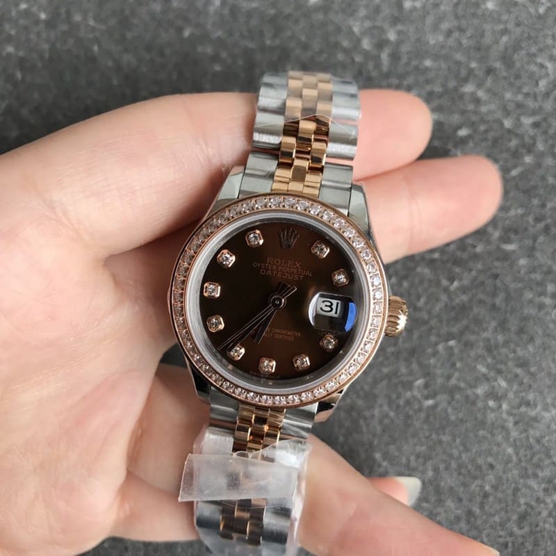 Refined Rolex Datejust women's watch, 28mm, mechanical bezel with diamonds, rose gold, coffee-colored dial, diamond hour markers, front view.
