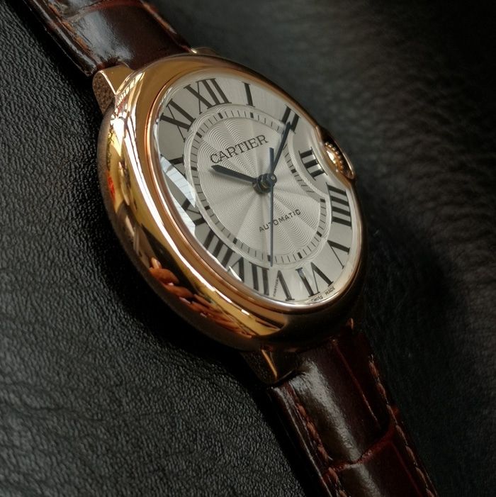 top-tier watch Cartier men's white dial blue balloon series c series leather strap watch side view
