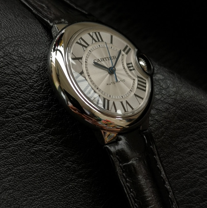 top-tier watch Cartier men's white dial blue balloon series leather strap watch side view