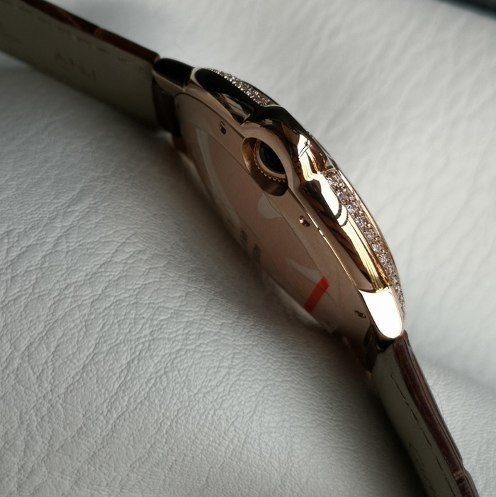 top-tier watch Cartier men's white dial blue balloon leather strap watch side view