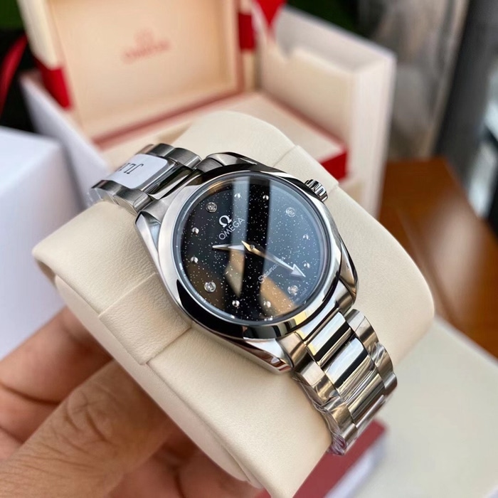 Top Omega women's Seamaster series black dial steel band watch front view
