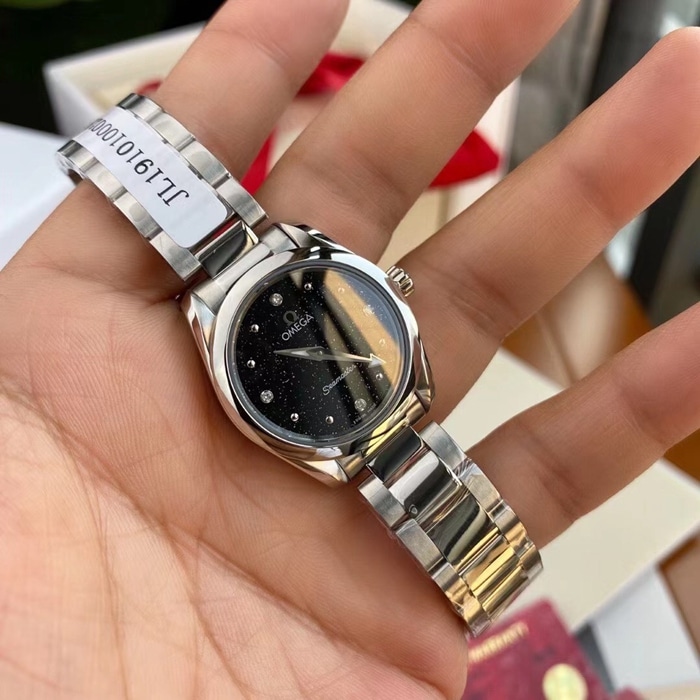 Top Omega women's Seamaster series black dial steel band watch front view