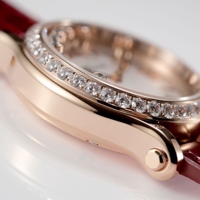 top-tier watch Chopard women's white dial red band HAPPY DIAMONDS series mechanical watch side view