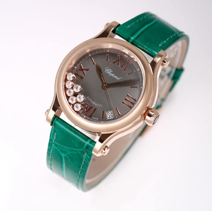 Top Chopard women's watch, black dial, green strap, HAPPY DIAMONDS series, mechanical leather strap, front view.
