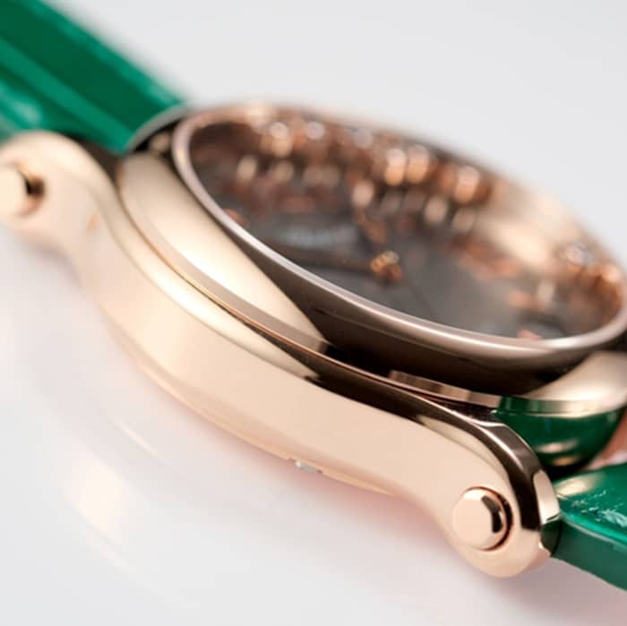 High Chopard women's watch, black dial, green strap, HAPPY DIAMONDS series, mechanical leather strap, side view