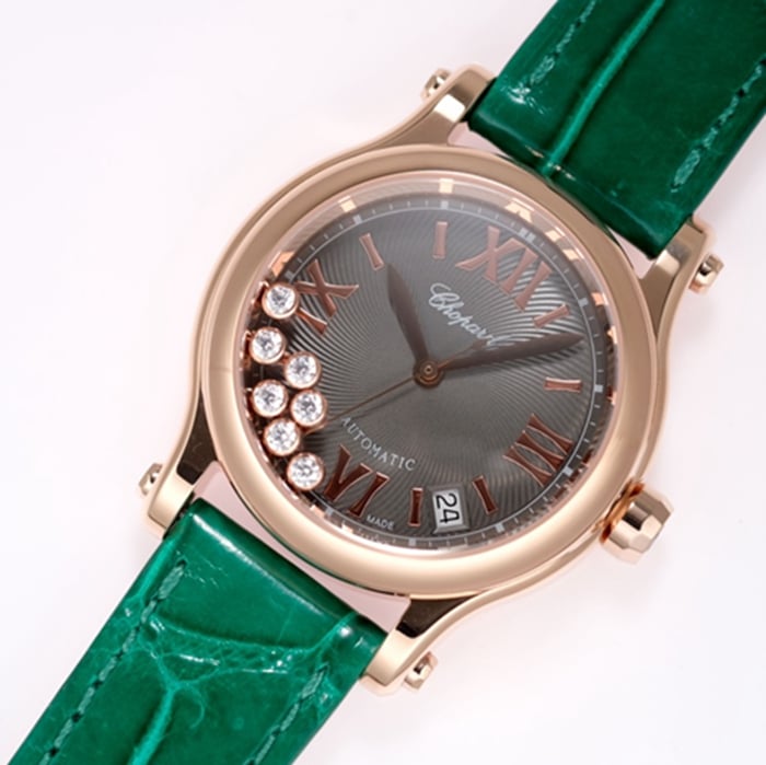 Top Chopard women's watch, black dial, green strap, HAPPY DIAMONDS series, mechanical leather strap, front view.