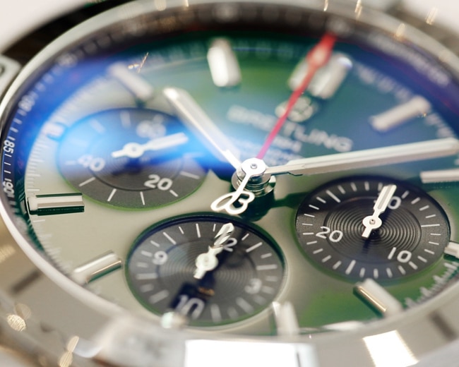 top-tier watch Breitling men's green dial steel automatic movement watch detail shots