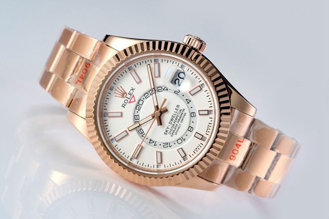 Top Rolex men's watch, white dial, rose gold, with the Explorer II series mechanical watch, front view.