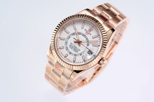 Top Rolex men's watch, white dial, rose gold, with the Explorer II series mechanical watch, front view.