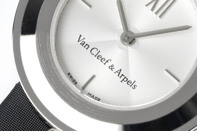 top-tier Van Cleef & Arpels women's white dial black belt quartzleather strap watch detail shots