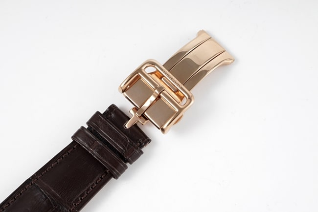 Top Hermes men's watch with white dial, brown strap, quartz movement, leather belt, clasp picture