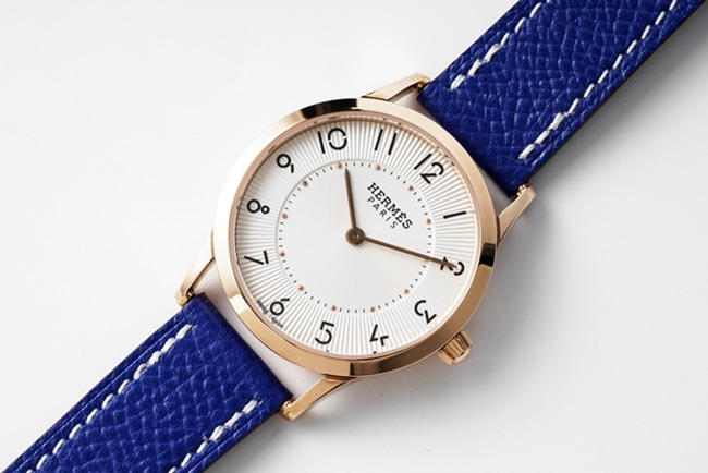 top-tier Hermès women's white dial blue band quartzleather strap watch front view