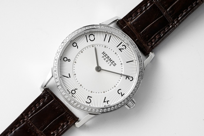 top-tier Hermès women's white dial black belt quartzleather strap watch front view