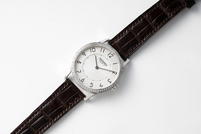 top-tier Hermès women's white dial black belt quartzleather strap watch front view