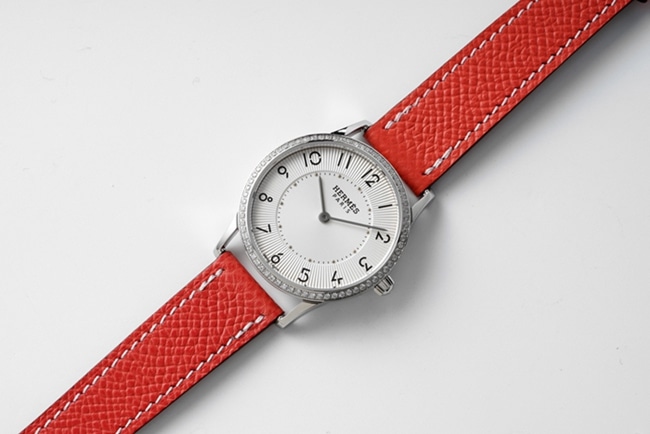 top-tier Hermès Slim d’Hermes women’s white dial red band quartz watch front view