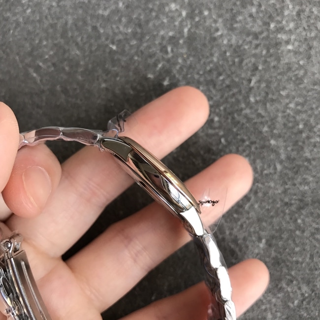 DK factory top-tier replicaOmega super a watch women's white dial gold steel bracelet natural real diamond butterfly series quartz watch side view