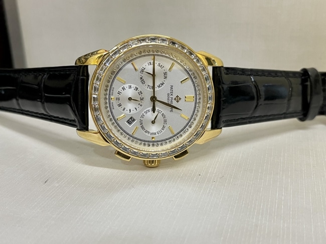 top-tier watch Patek Philippe women's white dial black belt complex chronograph function series leather strap watch front view