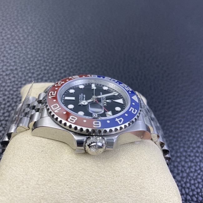 New top-tier watch, Rolex GMT-Master II "Coke" edition in red and blue, jubilee bracelet, automatic mechanical steel band, men's watch, side view.