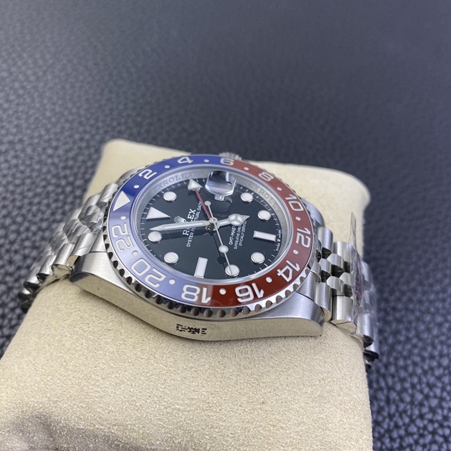 New top-tier watch, Rolex GMT-Master II "Coke" edition in red and blue, jubilee bracelet, automatic mechanical steel band, men's watch, side view.