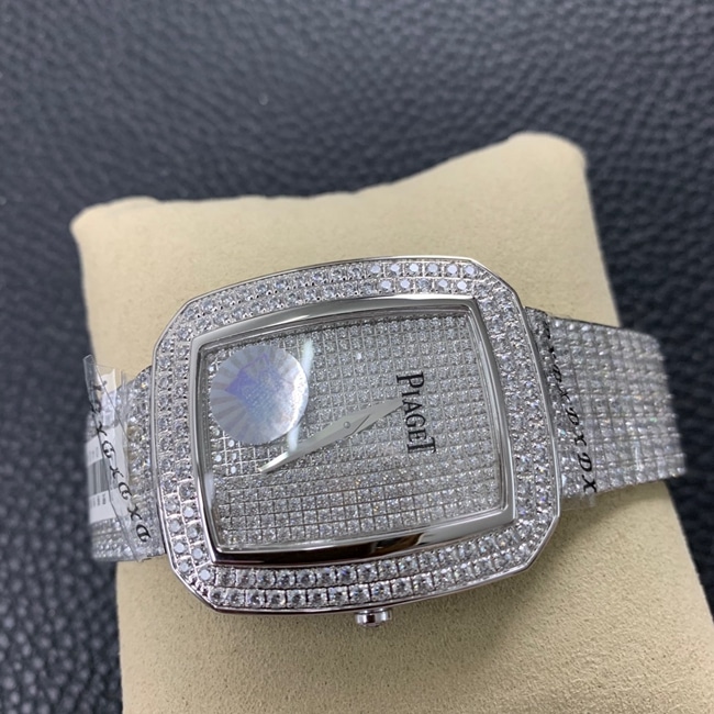Top Piaget women's watch, white dial, steel strap, Extraordinary Treasures collection, full diamond watch, front view.