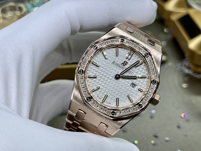 top-tier watch Audemars Piguet men's white dial gold band Royal Oak automatic movement watch front view
