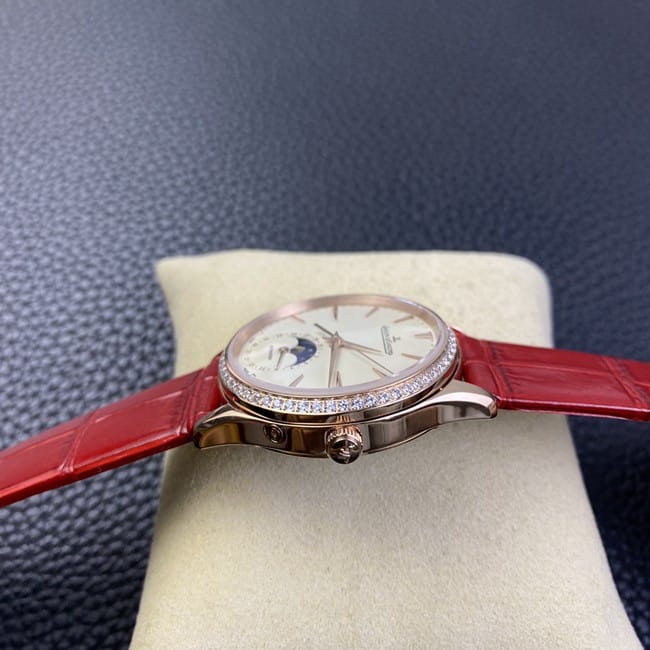 Jaeger-LeCoultretop-tier watch ladies white dial red dot moon phase master automatic movementleather strap side view
