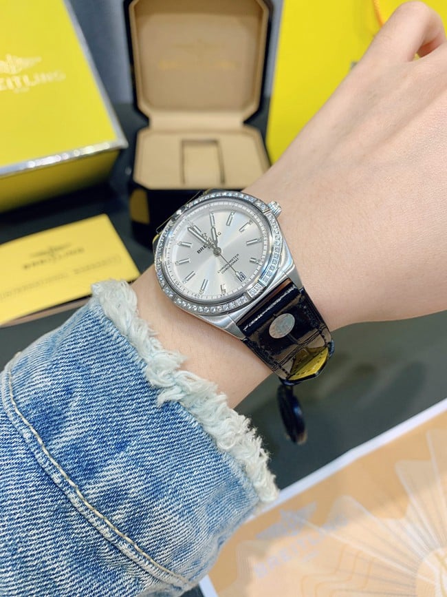 Breitlingtop-tier watch Nanhai capsule series fully automatic movementleather strap women's white dial black belt front view
