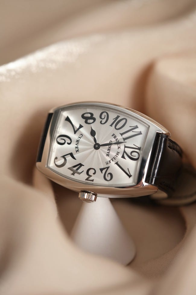 Franck Muller top-tier replicaquartz women's white dial black belt barrel-shaped leather strap watch front view