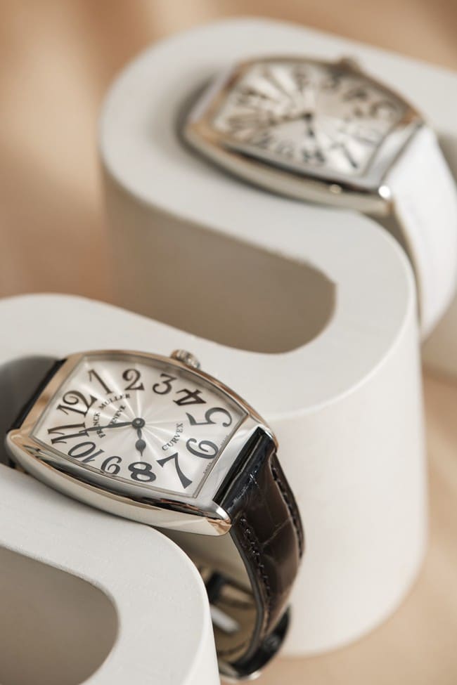 Franck Muller top-tier replicaquartz women's white dial black belt barrel-shaped leather strap watch front view