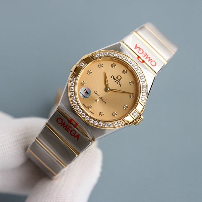 Omegatop-tiertop-tier ladies gold disc steel braceletquartz constellation series watch front view