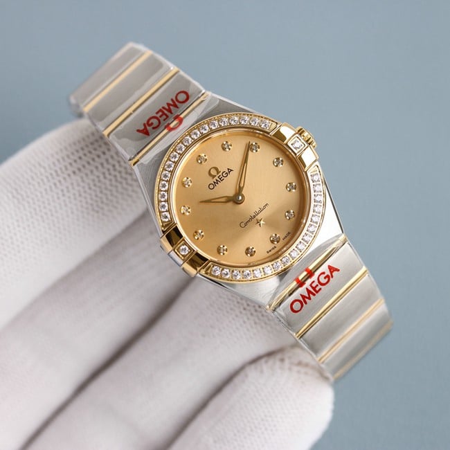 Omegatop-tiertop-tier ladies gold disc steel braceletquartz constellation series watch front view