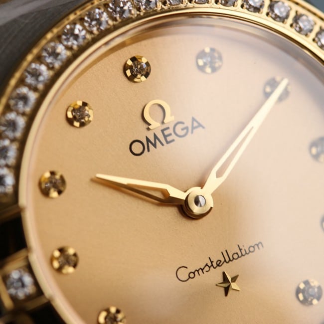 Omegatop-tiertop-tier ladies gold disc steel braceletquartz constellation series watch detail shots