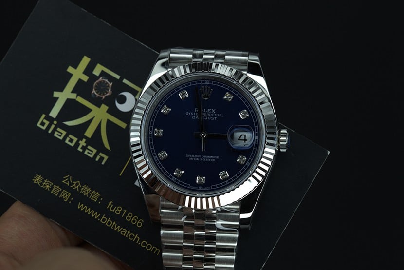 jvsRolex blue log watch tiger tooth ring front view